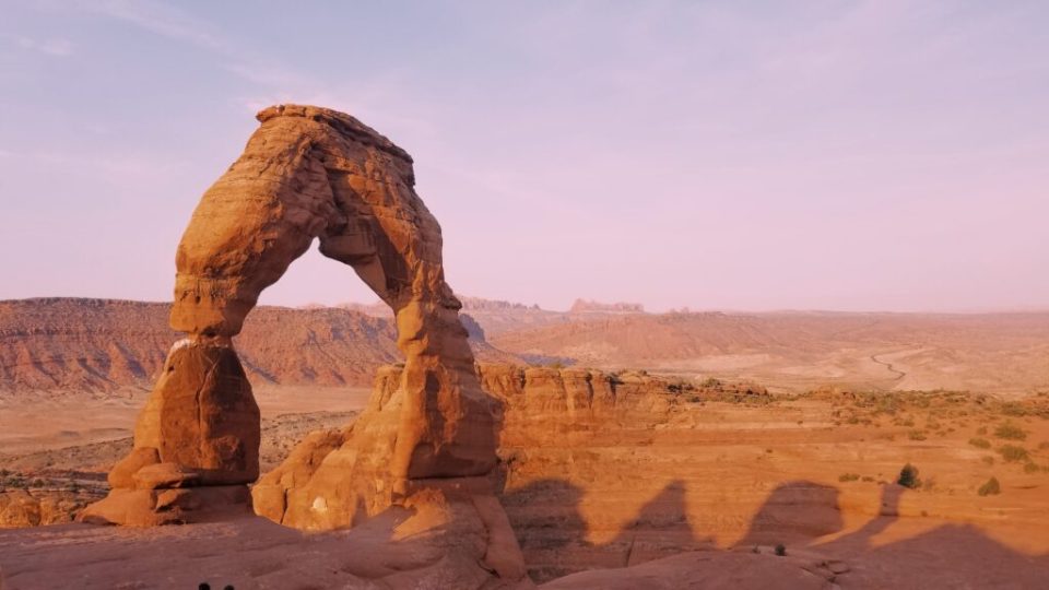 Photograph of Delicate Arch taken at sunrise.