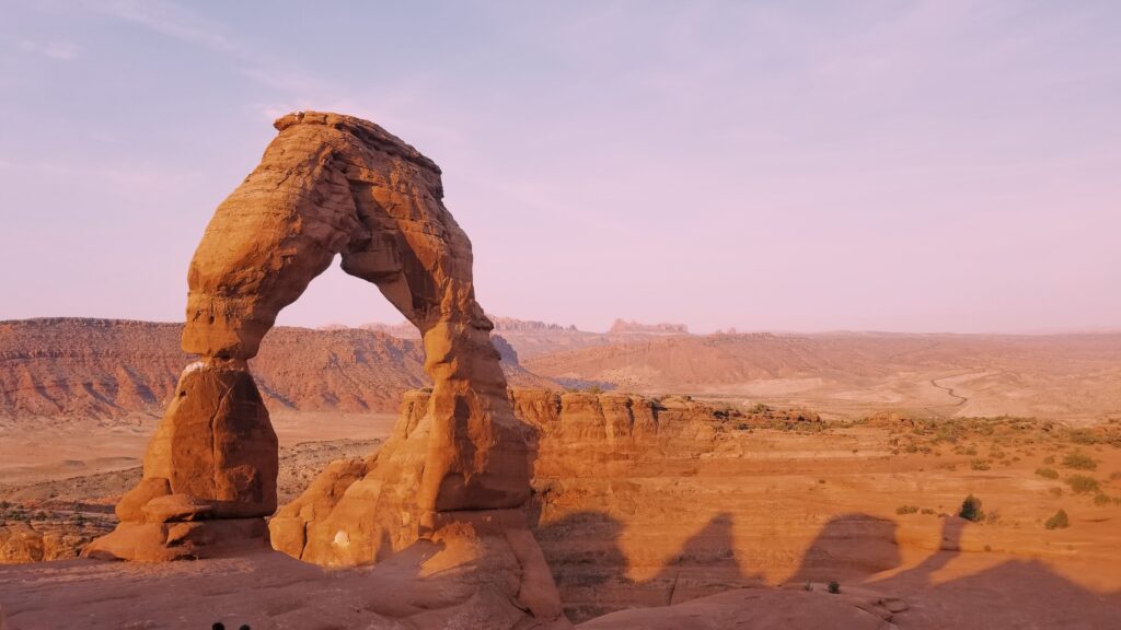 Photograph of Delicate Arch taken at sunrise.